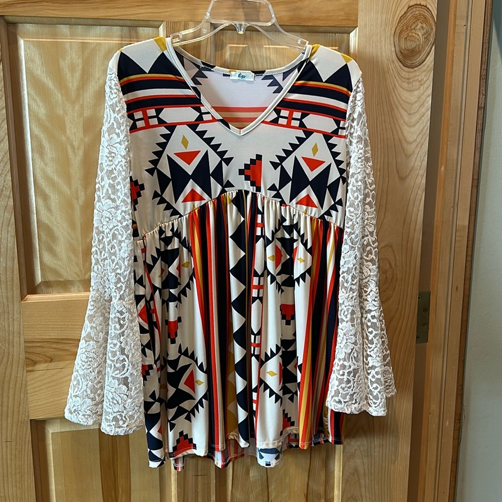 Aztec top with lace sleeves.